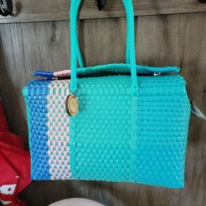 Maria Victoria Siquerios woven plastic basket tote. Bora Bora